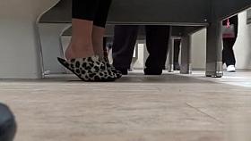 Female feet and shoes in the public toilet