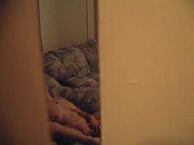 A voyeur masturbation video starring completely naked girl on the sofa