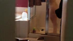 Stepmother filmed taking shower