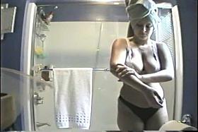 Hidden bathroom cam video of a teen with huge tits after shower