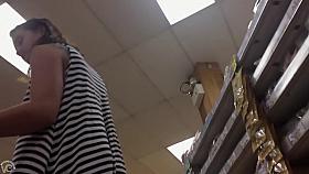 Grocery store upskirt with a pretty brunette girl
