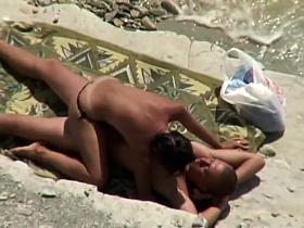 Woman initiates beach sex