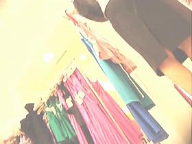 Amateur girl in changing room exciting spy up skirt view