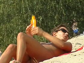 Beach video of perfect boobs being rubbed with tanning oil