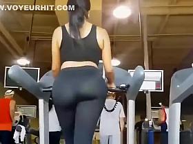 Big ass woman in tight sports pants at gym
