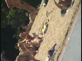 A dirty beach voyeur loves filming with his spy cam.