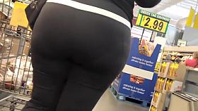 Raunchy bootylicious housewife walks around the supermarket
