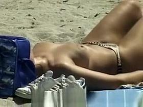 Hot blonde topless at beach