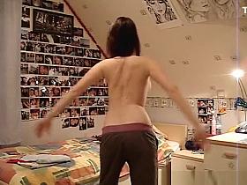 Girl dancing topless in front of the cam