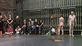 Mature couple flashes in nude art performance piece
