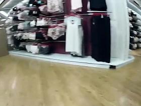 Woman bends over in a lingerie store