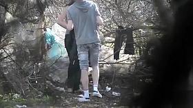 Skinny girl pees in the woods with her boyfriend