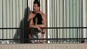 Girl fucked from behind on the balcony