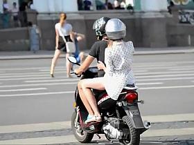 Girl on motorcycle shows some skin