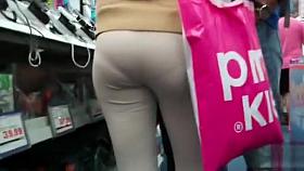 Female shopaholic in skintight pants