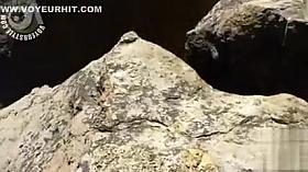 Drilling her twat between the rocks