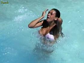 Horny bikini downblouse of busty Latina in the pool
