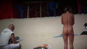 Hot wife flaunts her bushy muff on a nudist beach