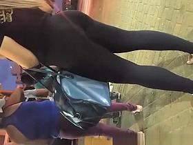 Brunette girl in black legging nice ass