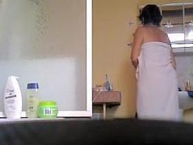 Milf with fatty belly and bushy cunt showering on spy cam