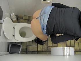 Girl in jeans skirt and tiny thong on toilet spy camera