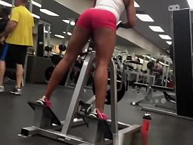 Woman in tight pink sports shorts