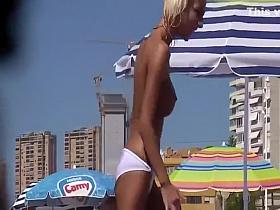 Sexy topless girl in a white bikini