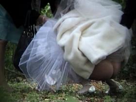 Beautiful bride is pissing outdoor on the piss spy video