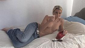 Skinny blonde in jeans shows tits in down blouse video
