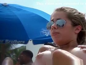 Big natural tits chick topless in the beach