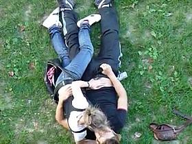 Young couple having sex in public park