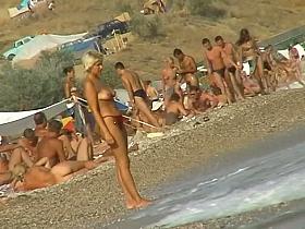 Hidden cam beach catches sexy nudist women sunbathing