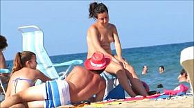 Topless beach beauty in Spain
