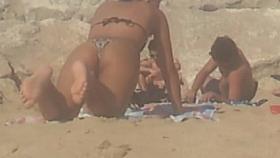 girl in push-ups on the beach in thong
