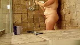 Chubby woman taking shower