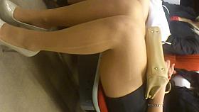 Sexy lady with laddered stockings in train