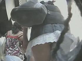 Hidden cam goes up the skirt of a chubby Latina