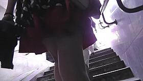 Redhead in mini skirt flashes ass in upskirt video