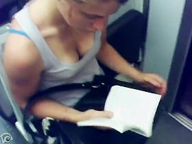 Great cleavage on a chick reading on the train