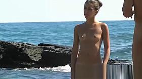 The pretty beach nudist girl has something