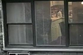 Topless neighbor girl in a window peep