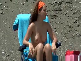 Nudist woman with round firm tits