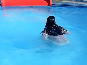 Sweet brunette doll has lost her bikini panty in the pool