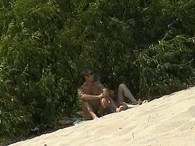 Nudist beach voyeur vid with a hot brunette milf
