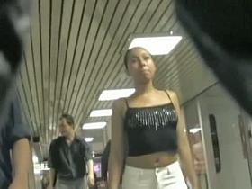 Tight ass of a black hair in the metro voyeur video