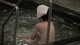 Naked Asian sitting back to the voyeur cam in shower room nri039 00