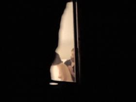 Brunette next door voyeured naked through the curtains