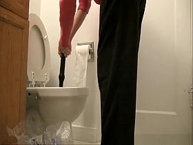 Woman caught peeing and unclogging the toilet