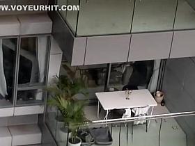 Neighbor spied topless in balcony