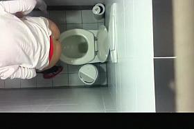 Spy camera in public toilet ceiling